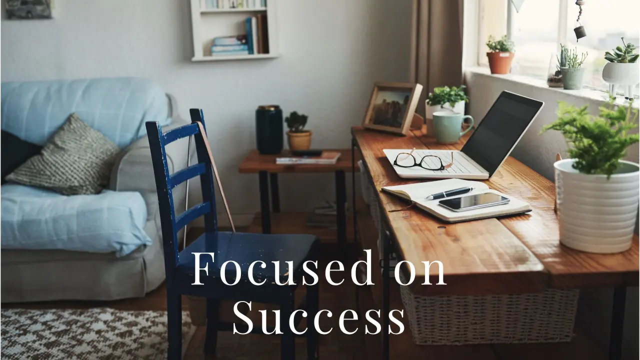 A cozy and productive home office setup with a laptop, notebook, and plants on a wooden desk. A digital marketing expert in Dubai focusing on success and growth in the online space.